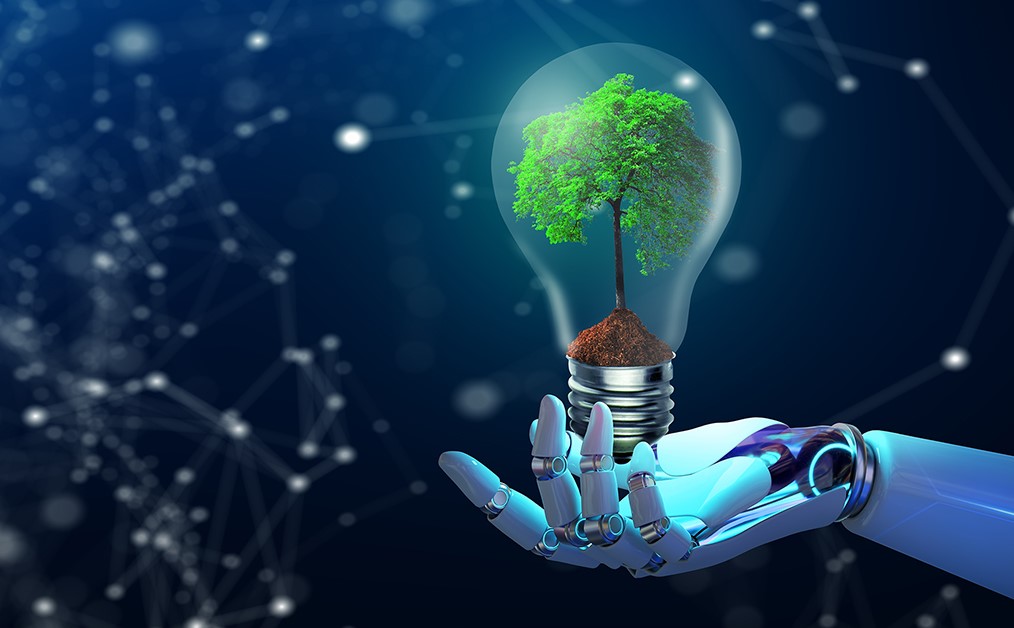 a hand holding a bulb with a tree inside